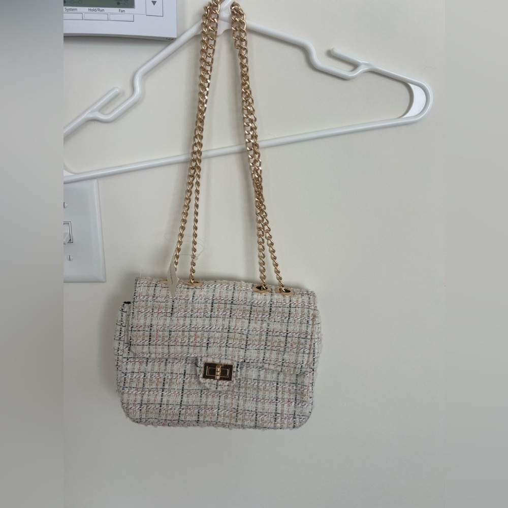 A Francesca’s bag that is new with tags and never been worn.